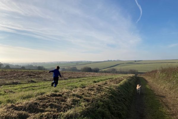 James & Nellie running in the fields